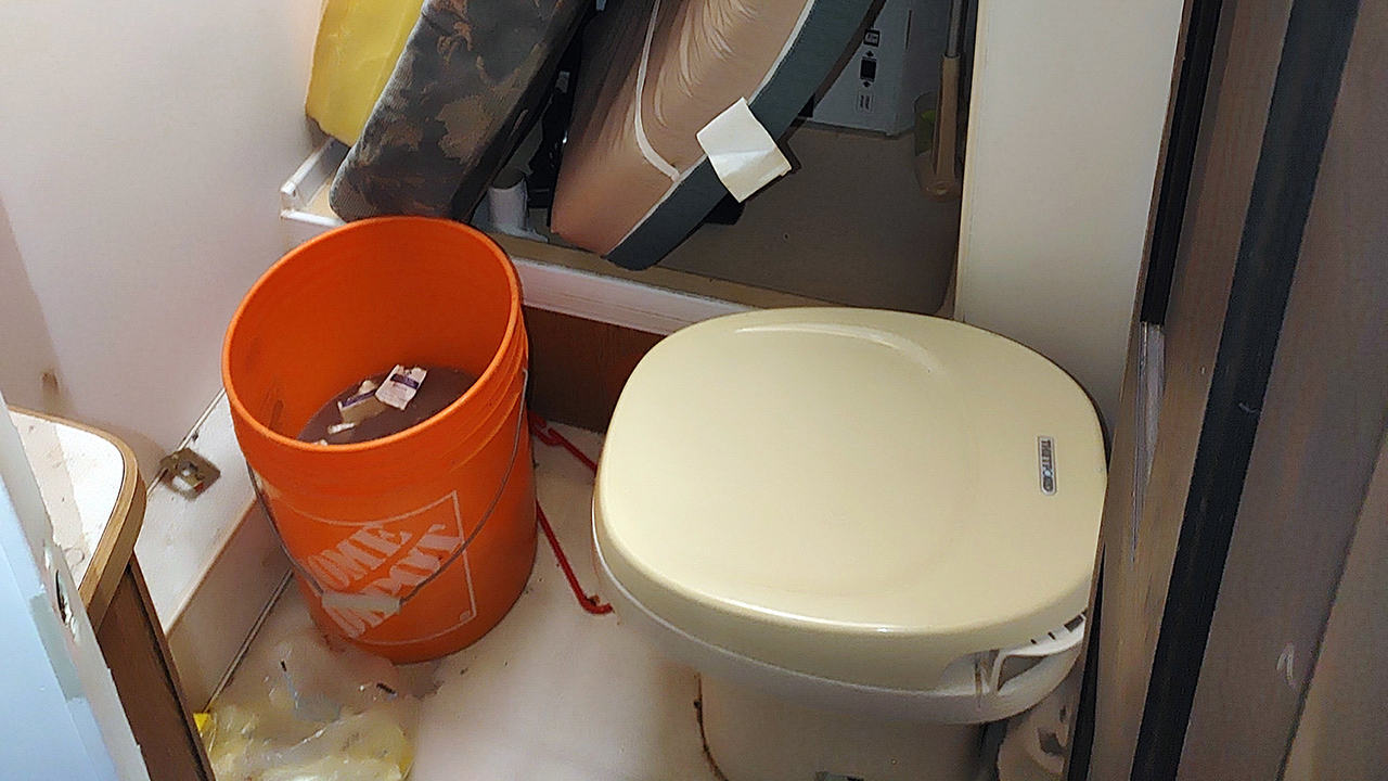 This bucket, which was not frozen likely due to the use of saltwater, was used in place of the frozen toilet.