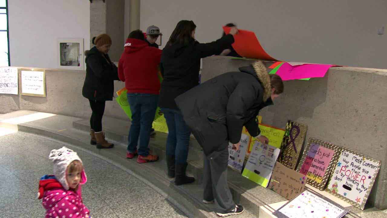 Supporters mounted their signs as the next generation of women watched